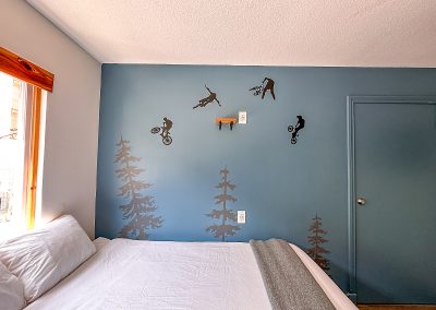 Basic Room One Queen Plus One Bunk Bed view of the wall art at The Crash Hotel Squamish