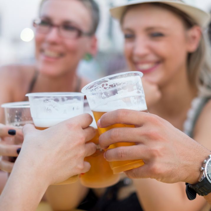 Friends cheersing beer at a beer festival | The Crash Hotel Squamish